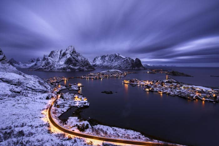 Roads in Reine lit up at night.