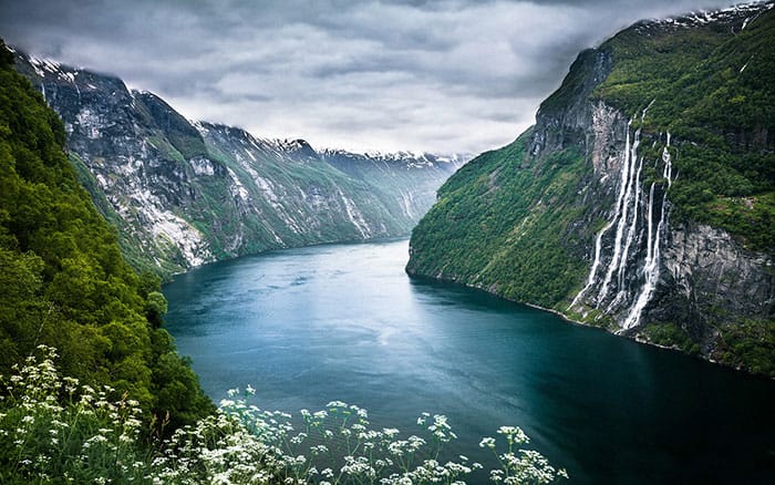 Seven Sister Falls. in one of the most famous fjords in Norway! Norway is one of the most breathtakingly beautiful countries in the world and these photos prove it! So amazing! Here are some of the top places to see in Norway. #norway #norwayphtoos #norwayphotography #avenlylanetravel #avenlylane #europe #travelinspiration #beautifulplaces 
