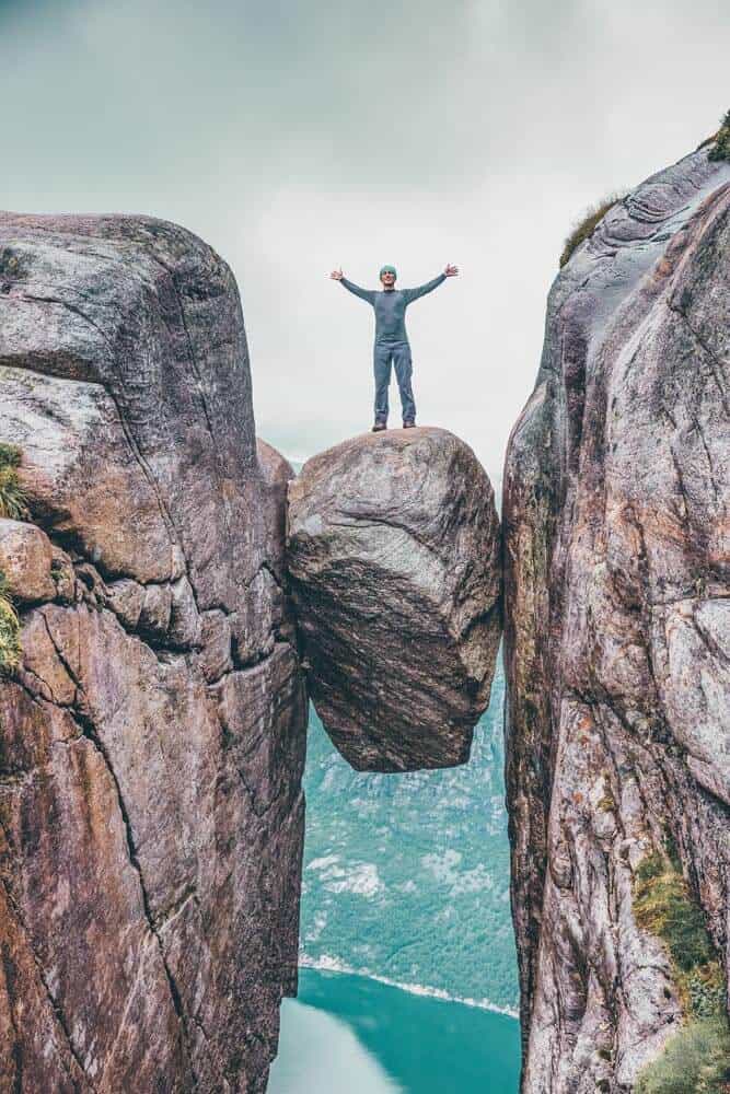 The Hanging Stone in Norway! Not sure I would be brave enough to walk on this. What about you? Seven Sister Falls. in one of the most famous fjords in Norway! Norway is one of the most breathtakingly beautiful countries in the world and these photos prove it! So amazing! Here are some of the top places to see in Norway. #norway #norwayphtoos #norwayphotography #avenlylanetravel #avenlylane #europe #travelinspiration #beautifulplaces