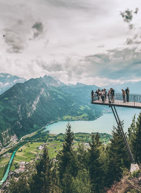 Interlaken Switzerland view! If you are on the hunt for the most beautiful places in Switzerland to add your Switzerland travel itinerary, Interlaken should be at the top of your bucket list! Do you agree? Find out why we think so at www.avenlylanetravel.com #switzerland #summertravel #switzerlanditinerary #europebucketlist #avenlylane #avenlylanetravel #interlakenswitzerland