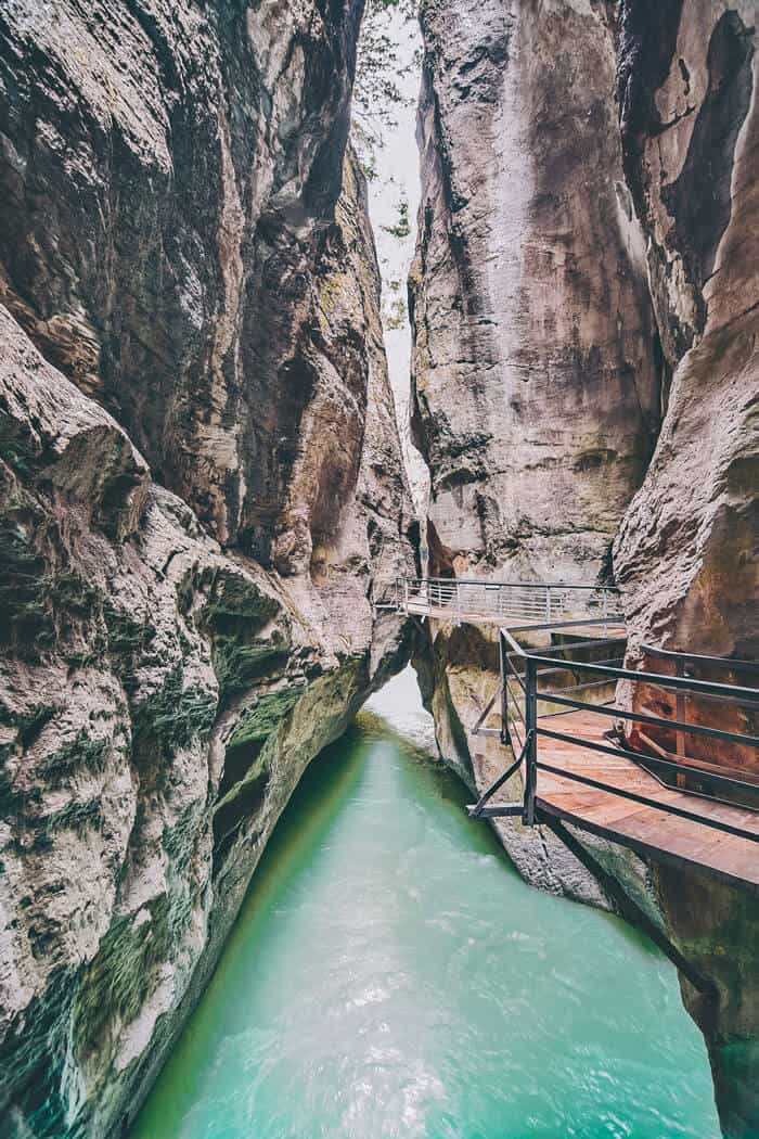 Aare Gorge Canyon Walk! If you are on the hunt for the most beautiful places in Switzerland to add your Switzerland travel itinerary, Aare Gorge should be at the top of your European bucket list! Do you agree? Find out why we think so at www.avenlylanetravel.com #switzerland #summertravel #switzerlanditinerary #europebucketlist #avenlylane #avenlylanetravel #switzerland #europebucketlist #europetravel #switzerlandtravel