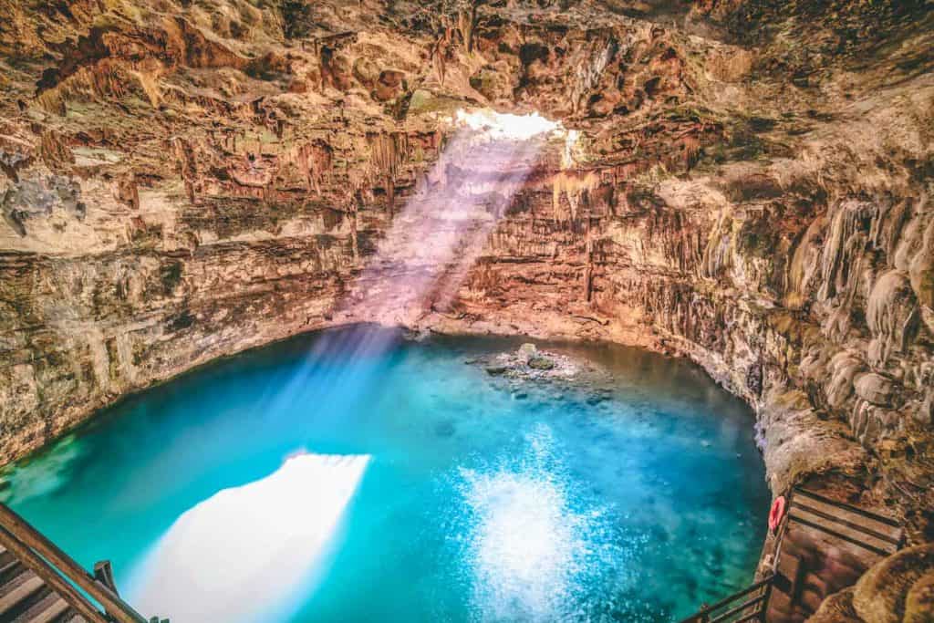 Cenote Samula sinkhole light beam near Valladolid in Yucatan Mexico