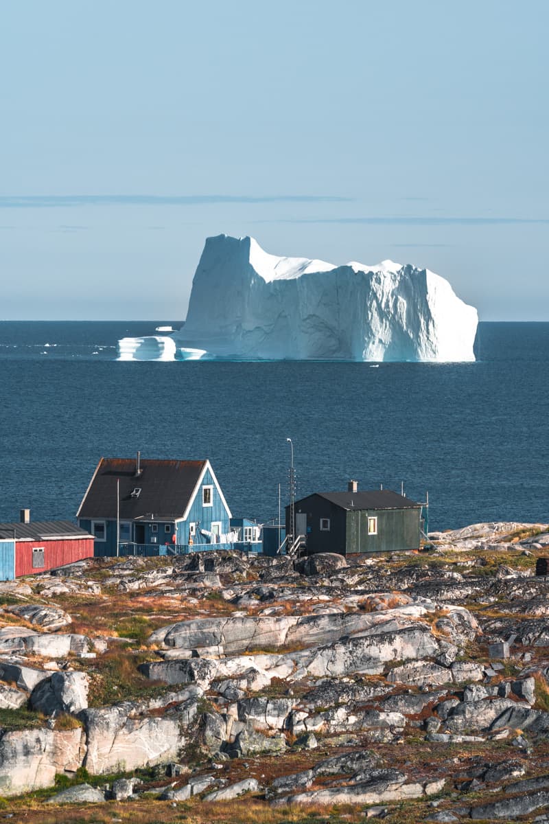 Rodebay, also known as Oqaatsut is a fishing settlement north of Ilulissat. Disco Bay and qeqertarsuaq. Blue Sky and sun.