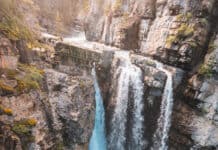 Upper Johnston Canyon Falls pour over a cliff wall