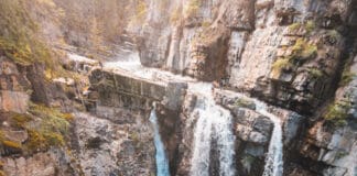 Upper Johnston Canyon Falls pour over a cliff wall