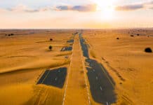 Dubai half desert sand road in UAE