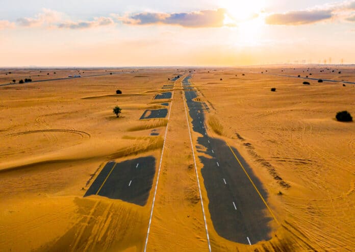 Dubai half desert sand road in UAE