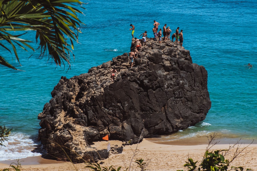 Cliff jumping at Waimea Bay in Haleiwa, Hawaii.