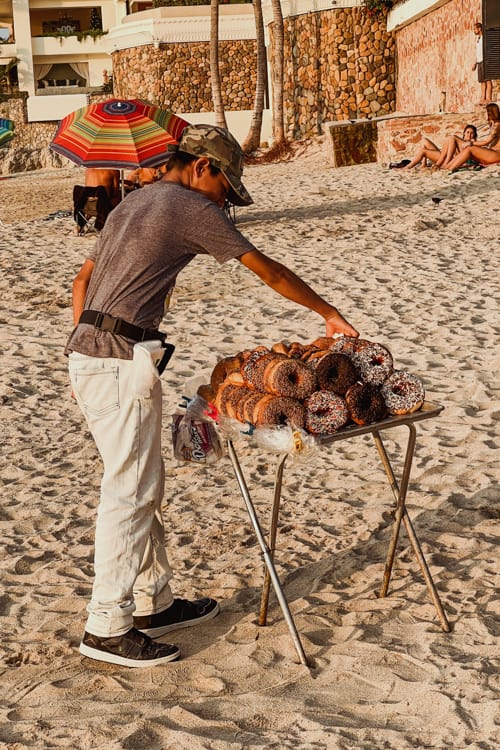 Conchas Chinas Beach vendors selling donuts