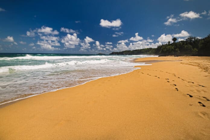 Secret Beach or Kauapea Beach on the north shore of Kauai, Hawaii.