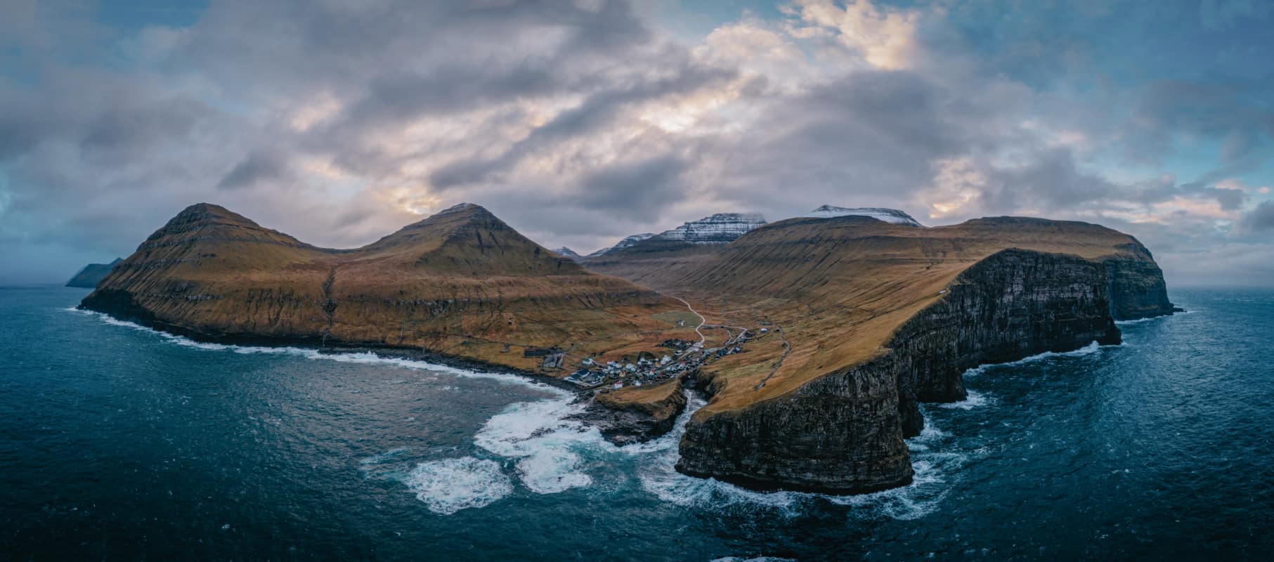 Natural harbour gorge nearby idyllic village Gjogv. Eysturoy Island on the Faroe Islands. 