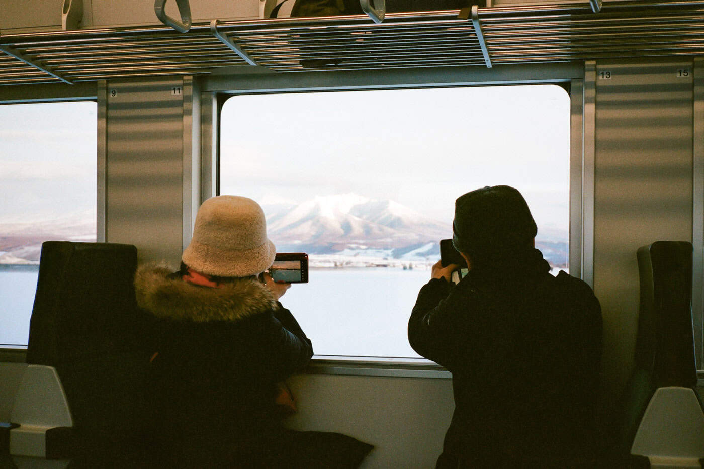 Couple taking photos on the train to Biei Japan